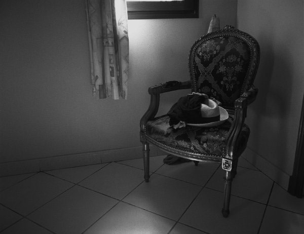 Still life with hat and chair