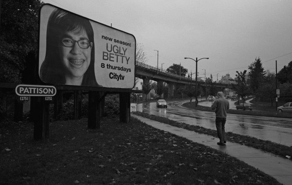 Ugly Betty  smiling in the rain